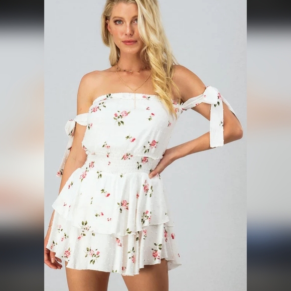 White Romper Dress with ruffle skirt, self tie straps, and floral embroidery. - Picture 4 of 6
